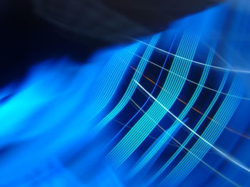 Close-up of guitar against blue background