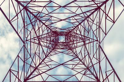 Low angle view of electricity pylon against sky