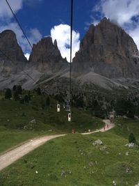 Scenic view of landscape and mountains against sky from a cableway