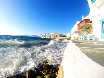 Scenic view of sea against clear blue sky