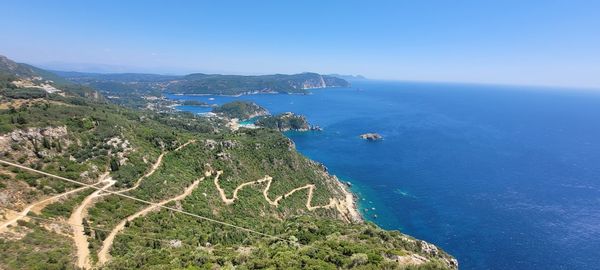 High angle view of sea against clear blue sky