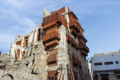 Low angle view of old building against sky