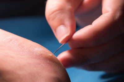 Close-up of person holding hands