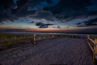 Scenic view of beach against sky during sunset
