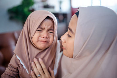 Portrait of young woman wearing hijab