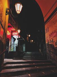 Illuminated steps in city at night