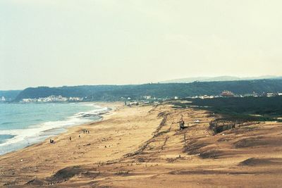 Scenic view of beach against clear sky