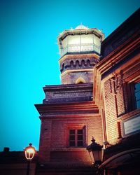 Low angle view of building against blue sky