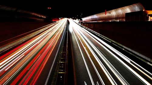 High angle view of light trails on road at night