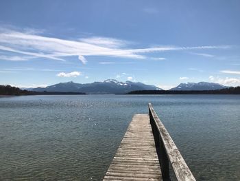 Pier over lake against sky