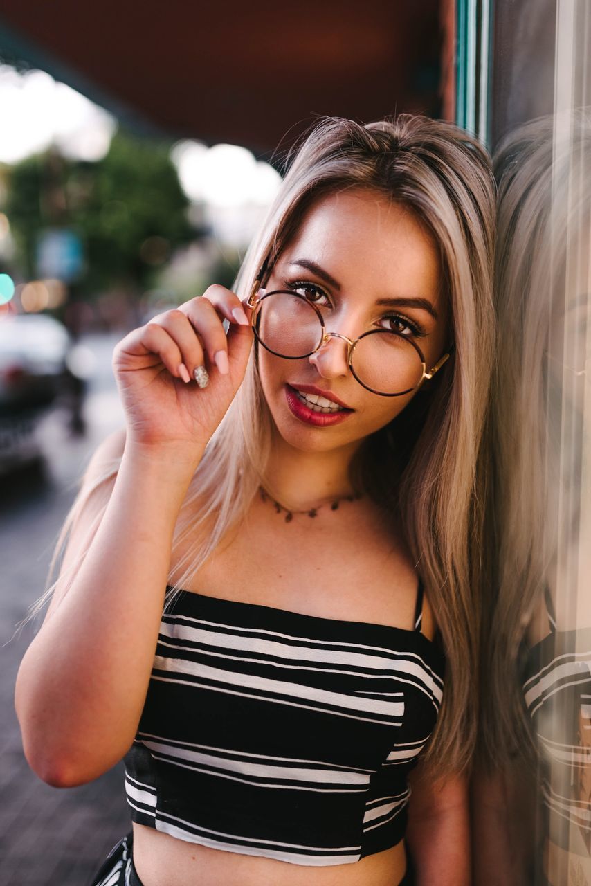 glasses, young women, young adult, portrait, one person, looking at camera, beautiful woman, hair, hairstyle, real people, beauty, front view, long hair, leisure activity, focus on foreground, waist up, smiling, eyeglasses, women, fashion