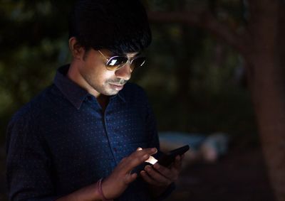 Young man using mobile phone