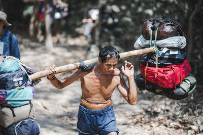 Group of people holding hands on land