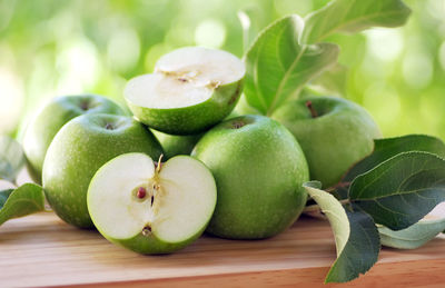 Close-up of green apples on table