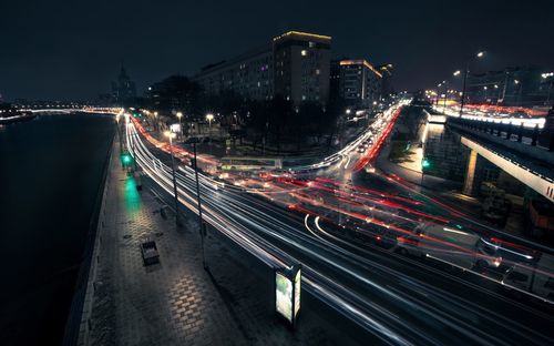 High angle view of light trails on road at night