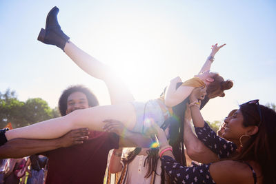 Group of people at party during sunny day