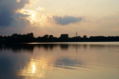 Scenic view of lake against sky during sunset