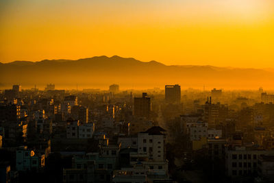 Cityscape against sky during sunset