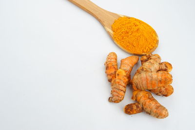 High angle view of carrots on white background