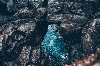 High angle view of rock formation over water 