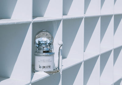 Low angle view of clock on wall in building