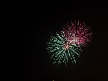 Low angle view of firework at night