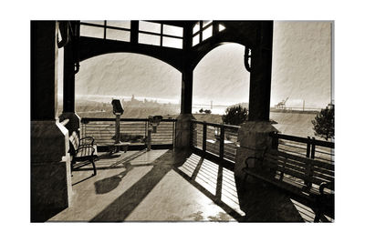 People on bridge against sky