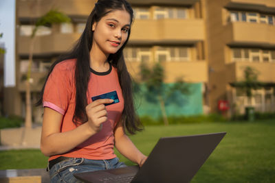 Young woman using mobile phone