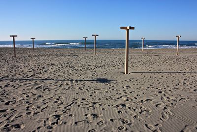 Scenic view of beach against clear sky