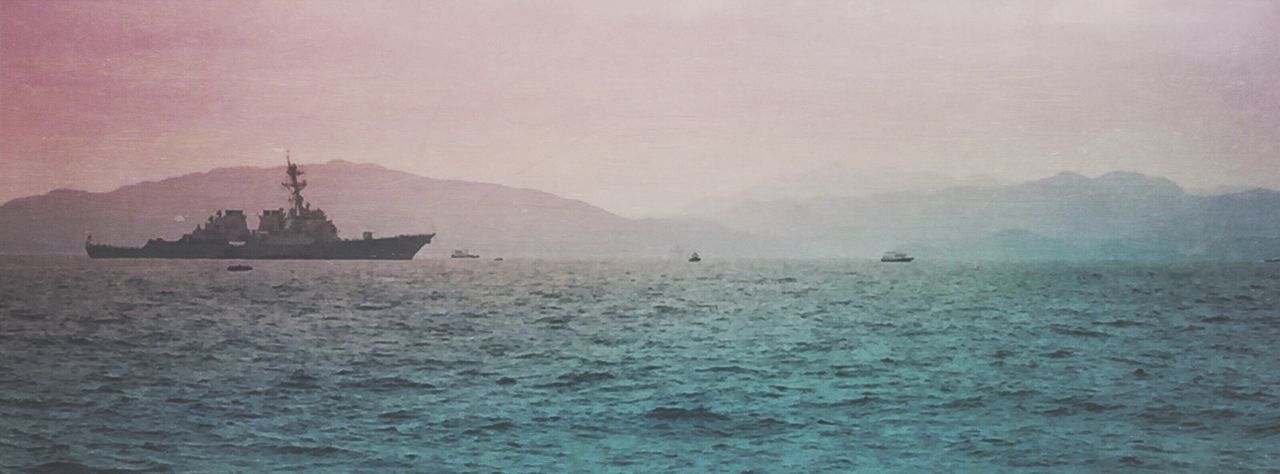 SHIP SAILING IN SEA AGAINST SKY