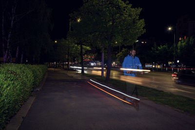 Light trails on street in city at night