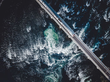 High angle view of waterfall by sea