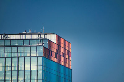 Low angle view of building against clear blue sky