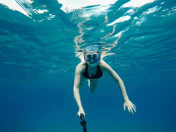 Woman swimming undersea