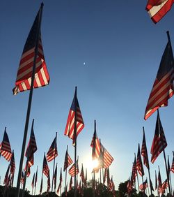 Low angle view of american flag against clear sky