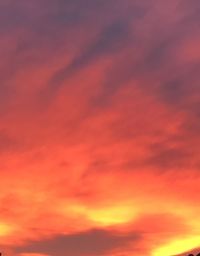 Low angle view of dramatic sky during sunset