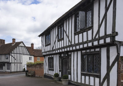 Exterior of buildings in town against sky in suffolk 