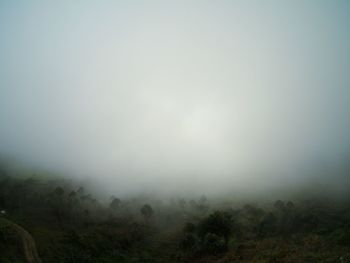 Scenic view of landscape in foggy weather