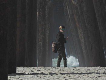 Rear view of man walking on rosarito beach bc mexico