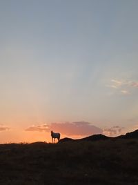 Scenic view of mountains against sky during sunset