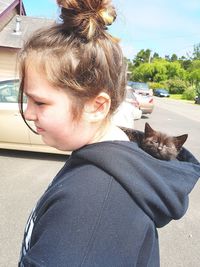 Portrait of woman with cat