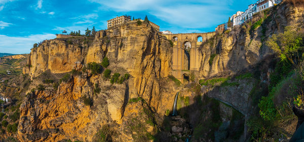 Panoramic view of rock formations against sky