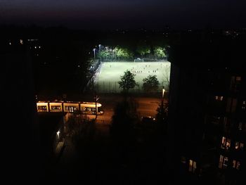 High angle view of illuminated buildings in city at night