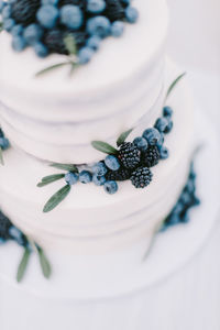 High angle view of fresh white cake on table