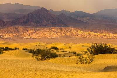 Scenic view of landscape and mountains against sky