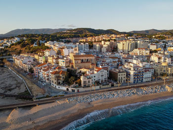 Aerial view of sant pol de mar village and its church ermita de sant jaume in el maresme coast.