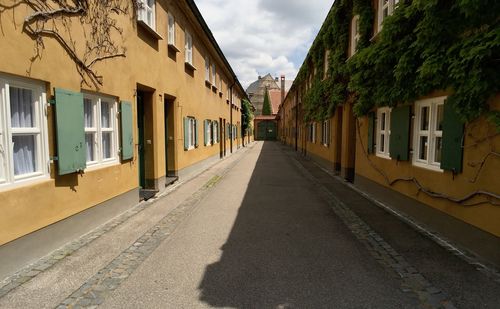 Alley amidst buildings in city