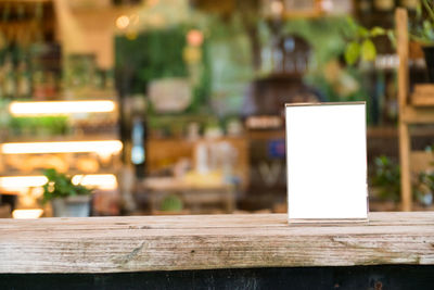 Close-up of illuminated lamp on table