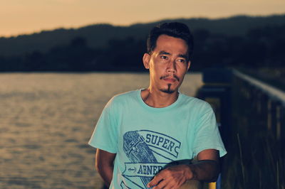 Portrait of young man standing outdoors