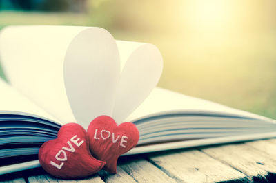 Close-up of heart shape on book